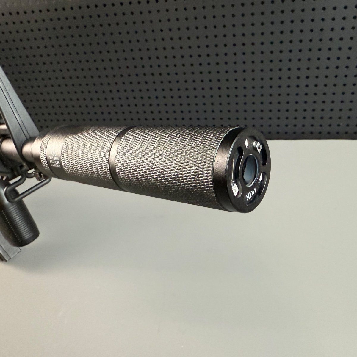 Close-Up of KSC Tactical Suppressor – Non-Slip Grip and Threaded Mount